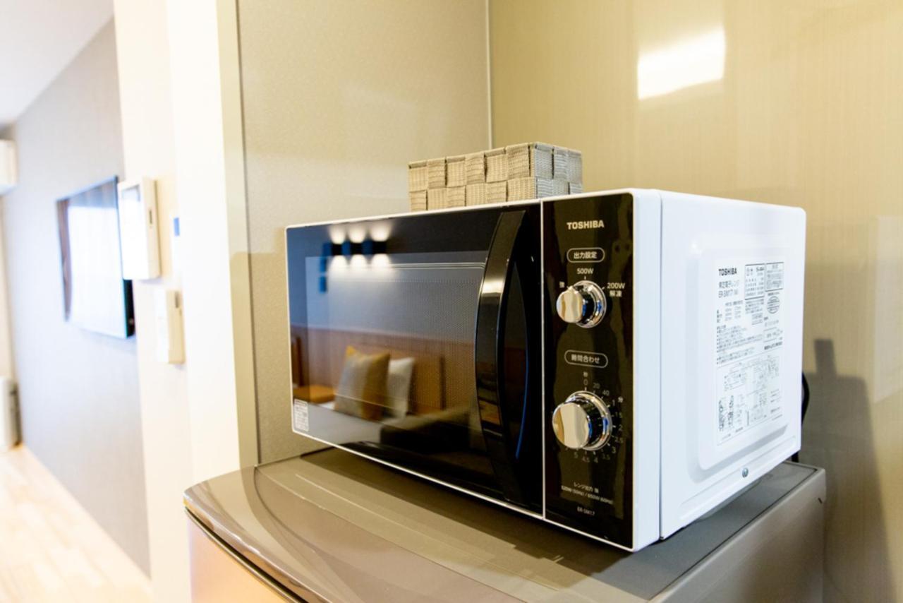 Grand Base Hiroshima Hikarimachi Aparthotel Exteriör bild